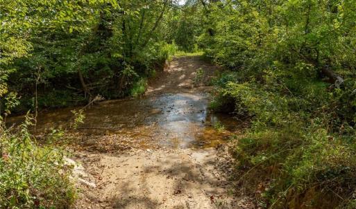 Here is access to the property.  30 foot easement off Wright Road (Private Road) provides access to the property.    Wright Road is an old farm road and rugged in spots.  4 WHEELED DRIVE VEHICLE IS REQUIRED TO  FORD THE CREEK AND ACCESS THE PROPERTY.