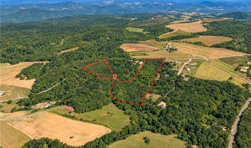 20.65 Acres Wooded Land for Sale Orange County NC. Aerial view of about 20.65 wooded acres for sale in Orange County, NC, between Chapel Hill and Mebane near Saxapahaw. Creekfront land on a paved road for a country home, mini farm or homestead. Boundary approximate.