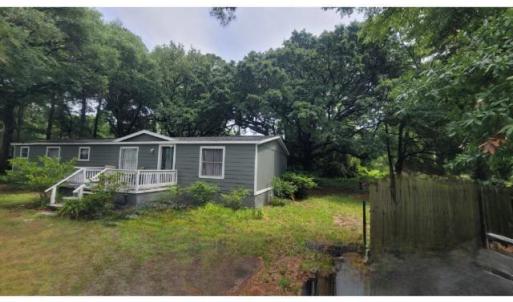 View of yard with a deck
