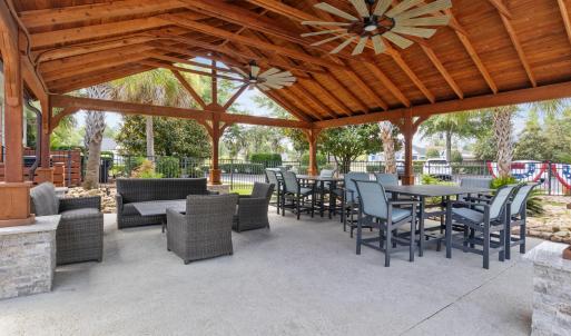 View of patio with ceiling fan and a gazebo