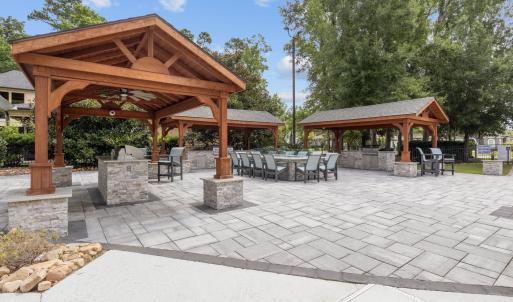 View of patio with a bar, a gazebo, ceiling fan, a