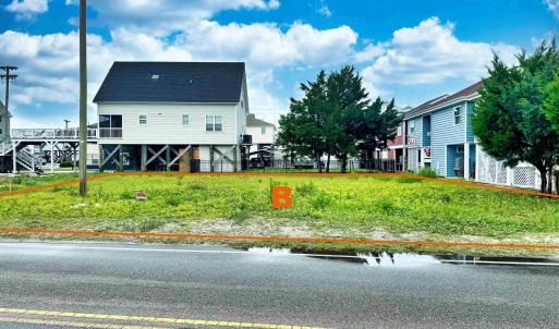 Exterior space featuring a front lawn
