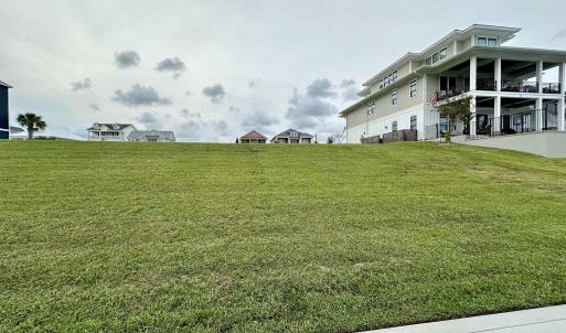 View of yard featuring a balcony
