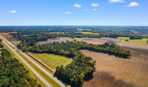 Birds eye view of property featuring a rural view