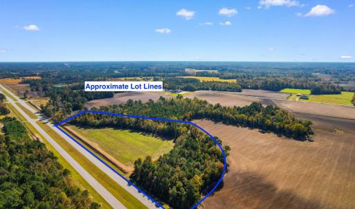 Birds eye view of property featuring a rural view