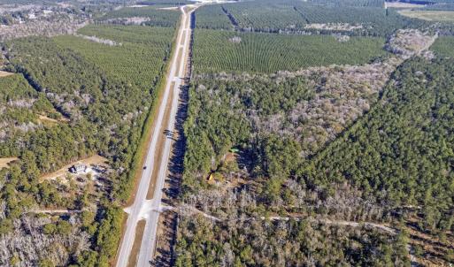 Birds eye view of property featuring a rural view