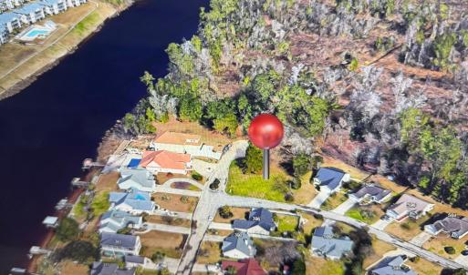 Bird's eye view featuring a water view and a resid