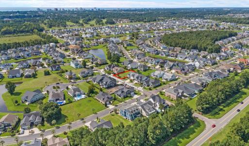Aerial view of property and surrounding area with