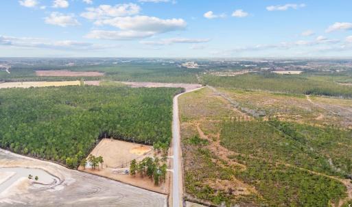 Birds eye view of property with a rural view