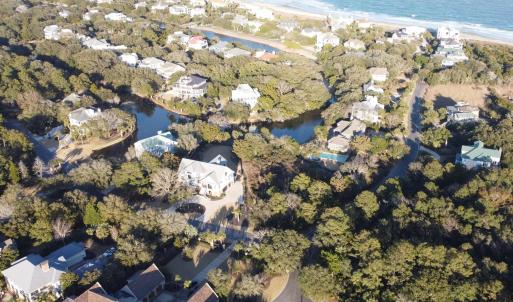 Aerial view featuring a water view and a view of t