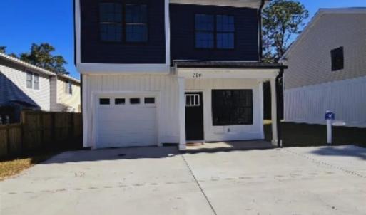 View of front of property with board and batten si