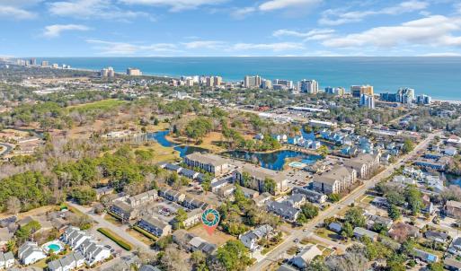 Drone / aerial view featuring a water view and a c