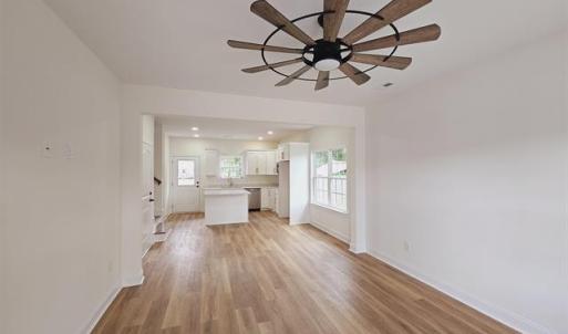 Unfurnished living room with light wood-type floor