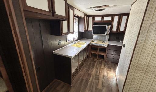 Kitchen featuring light countertops, stainless ste