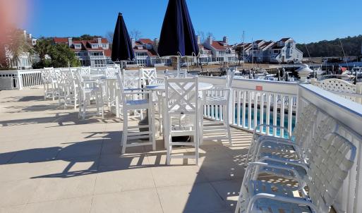 View of patio / terrace with fence and a community
