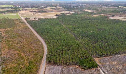 Birds eye view of property with a rural view