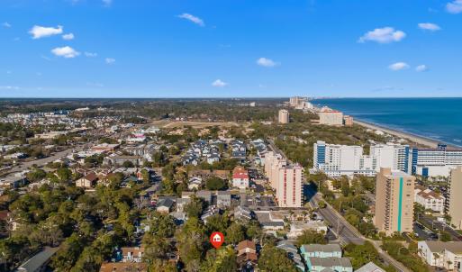 Birds eye view of property featuring a water view,