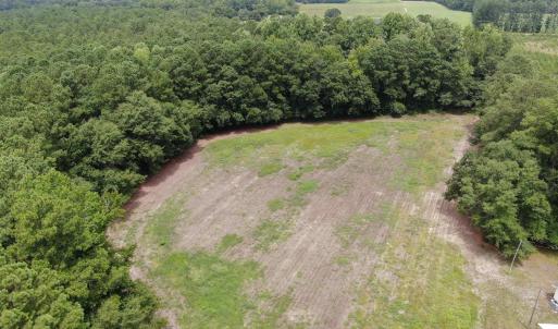Drone / aerial view with a wooded view