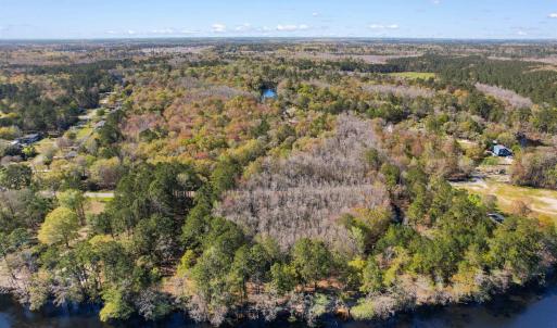 Aerial view featuring a water view and a view of t