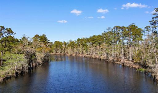 Property view of water with a forest view