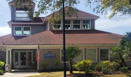 View of front of home with french doors and roof w