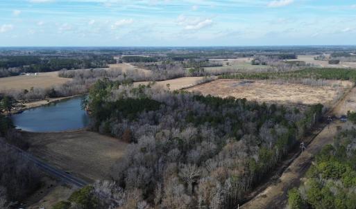 Aerial view featuring a water view and a rural vie