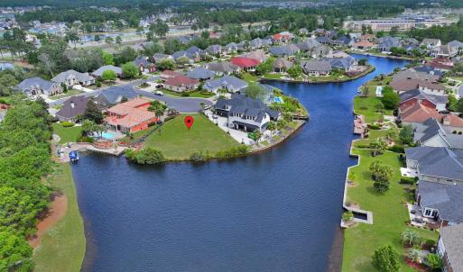 Aerial view featuring a water view and a residenti