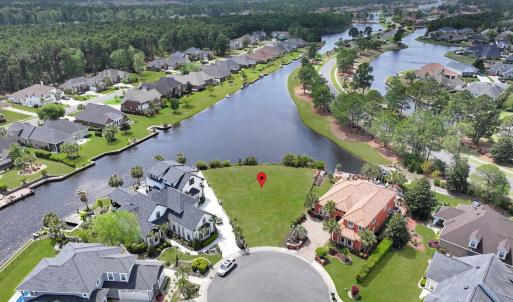 Drone / aerial view with a water view and a reside