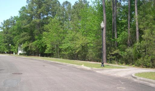 View of road with street lighting and curbs