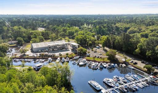 Bird's eye view with a forest view and a water vie