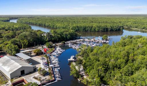 Drone / aerial view with a water view and a forest