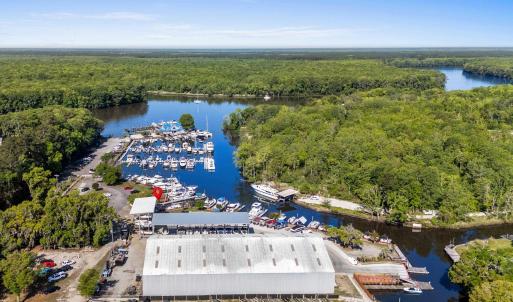 Birds eye view of property with a forest view and