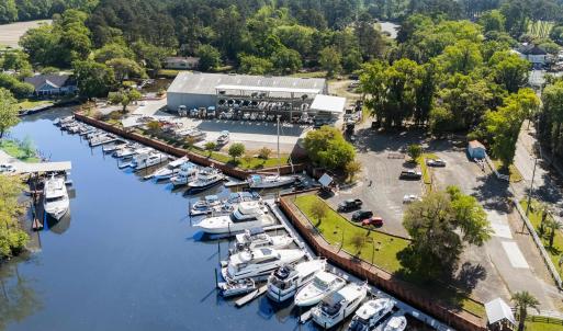 Drone / aerial view featuring a wooded view and a