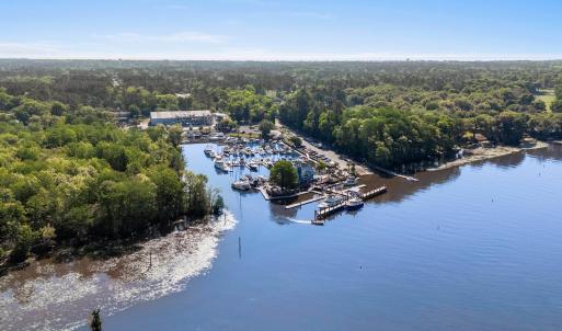 Drone / aerial view with a forest view and a water