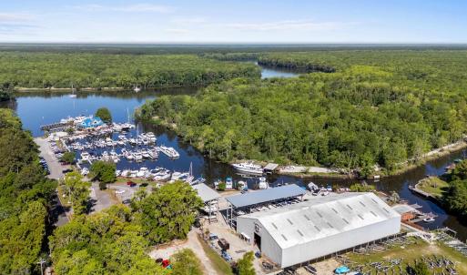 Bird's eye view with a forest view and a water vie