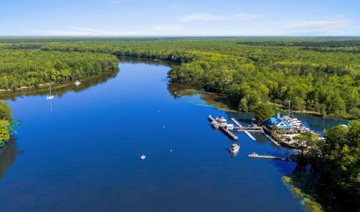 Birds eye view of property with a forest view and