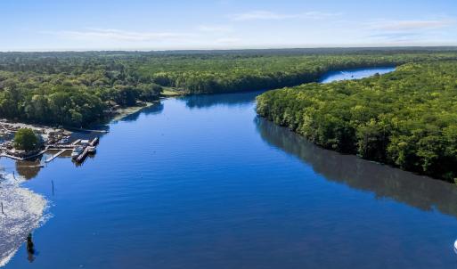 Bird's eye view featuring a forest view and a wate
