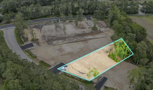 Birds eye view of property with a forest view