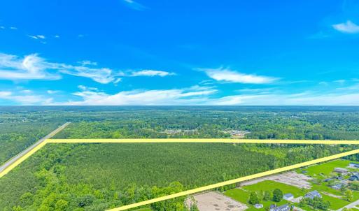 Aerial view of property and surrounding area with