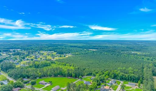 Aerial view of property and surrounding area with