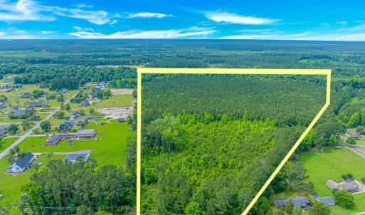 Aerial view of property's location with a heavily