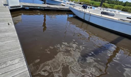 Dock featuring a water view