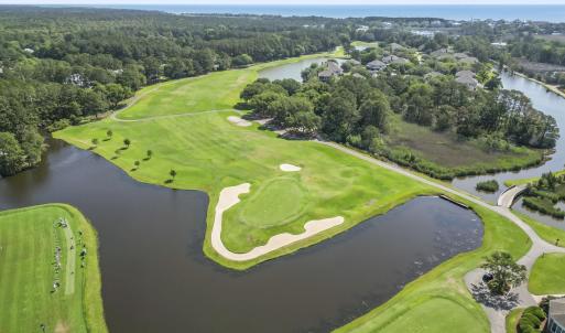 Drone / aerial view of a nearby body of water, a g