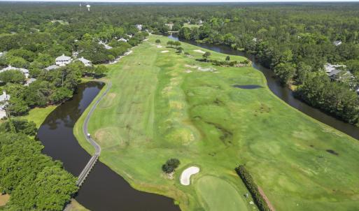 View of property location featuring a forest, a la