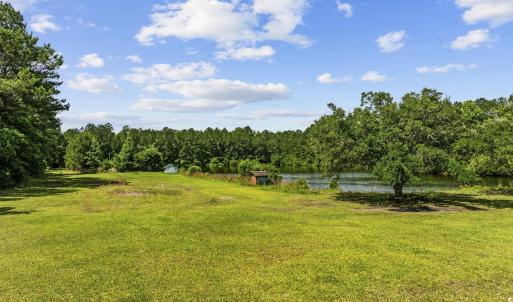 View of grassy yard featuring a water view, a view