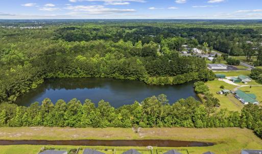Aerial view of property and surrounding area with