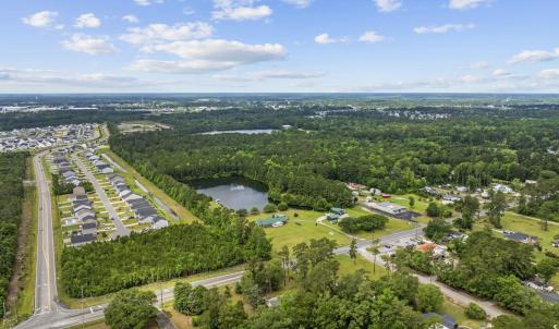Aerial view of property's location with a large bo