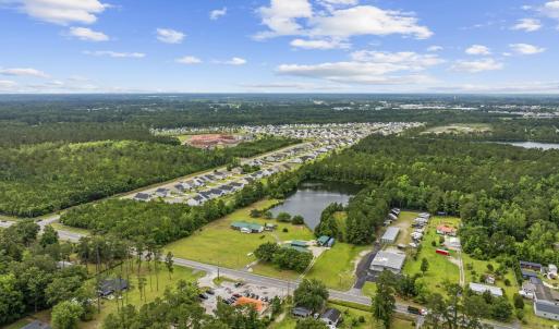 Aerial view of property and surrounding area featu