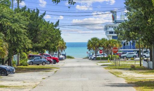 View of asphalt road featuring traffic signs