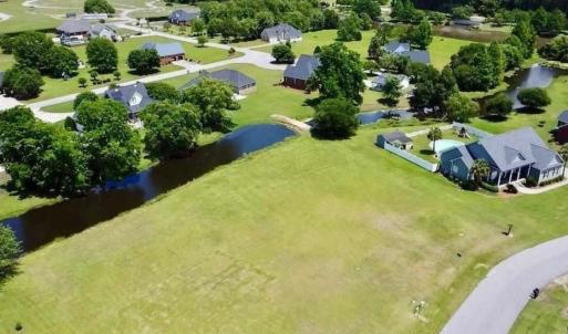 Aerial perspective of suburban area with a nearby
